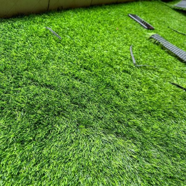 Enhance your outdoor or indoor spaces with our premium Artificial Grass Carpet in Kenya from Dream Sphere Interiors — the perfect blend of beauty, durability, and convenience. Designed to transform any area into a lush, green paradise, our synthetic grass provides a natural look that lasts all year round without the hassle of watering, mowing, or fertilizing.  Ideal for homes, schools, playgrounds, nightclubs, restaurants, and commercial spaces, our artificial grass is engineered to withstand heavy foot traffic while maintaining a soft, natural texture. It’s anti-slip, water-permeable, and built with UV-resistant fibers, ensuring long-lasting color and performance in all weather conditions.  Whether you’re creating a relaxing garden retreat or upgrading a high-use area, our Artificial Grass Carpet in Kenya delivers comfort, safety, and style. It’s particularly suitable for children’s play areas, offering a cushioned, safe, and mess-free surface.  Product Specifications  Roll Dimensions: 2 meters wide × 35 meters long (cut to required size)  Thickness Options: 15mm, 20mm, 25mm, 30mm, 35mm  Pricing  15mm – KSh 1,000 per SQM  20mm – KSh 1,200 per SQM  25mm – KSh 1,500 per SQM  30mm – KSh 1,600 per SQM  35mm – KSh 1,800 per SQM  How to Order  Measure your area (length × width) and contact us for a customized quote, including supply and professional installation.  Let Dream Sphere Interiors bring life to your lawns, balconies, and recreational areas with our premium Artificial Grass Carpet in Kenya — where beauty meets durability. - Image 3