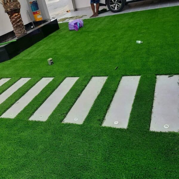Enhance your outdoor or indoor spaces with our premium Artificial Grass Carpet in Kenya from Dream Sphere Interiors — the perfect blend of beauty, durability, and convenience. Designed to transform any area into a lush, green paradise, our synthetic grass provides a natural look that lasts all year round without the hassle of watering, mowing, or fertilizing.  Ideal for homes, schools, playgrounds, nightclubs, restaurants, and commercial spaces, our artificial grass is engineered to withstand heavy foot traffic while maintaining a soft, natural texture. It’s anti-slip, water-permeable, and built with UV-resistant fibers, ensuring long-lasting color and performance in all weather conditions.  Whether you’re creating a relaxing garden retreat or upgrading a high-use area, our Artificial Grass Carpet in Kenya delivers comfort, safety, and style. It’s particularly suitable for children’s play areas, offering a cushioned, safe, and mess-free surface.  Product Specifications  Roll Dimensions: 2 meters wide × 35 meters long (cut to required size)  Thickness Options: 15mm, 20mm, 25mm, 30mm, 35mm  Pricing  15mm – KSh 1,000 per SQM  20mm – KSh 1,200 per SQM  25mm – KSh 1,500 per SQM  30mm – KSh 1,600 per SQM  35mm – KSh 1,800 per SQM  How to Order  Measure your area (length × width) and contact us for a customized quote, including supply and professional installation.  Let Dream Sphere Interiors bring life to your lawns, balconies, and recreational areas with our premium Artificial Grass Carpet in Kenya — where beauty meets durability. - Image 16